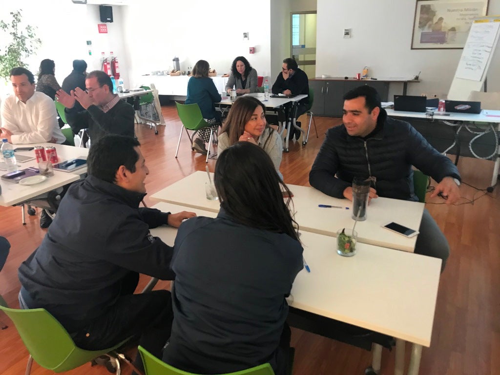 Clorox Chile employees sit around tables