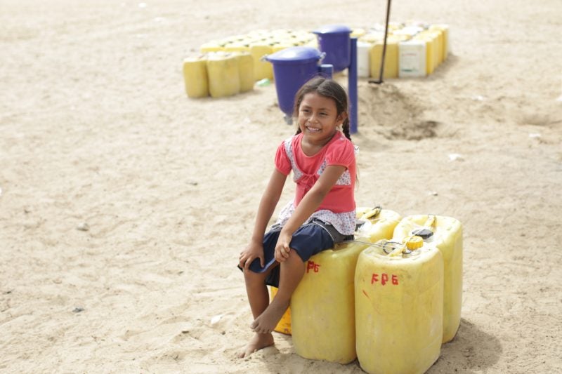 safe-water-peru_child-with-water-containers